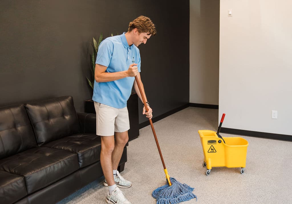 Mopping and cleaning the floor of commercial building